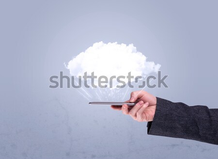 Hand holding phone with empty cloud Stock photo © ra2studio