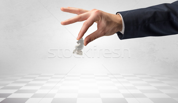 Big hand taking his next step on chess game Stock photo © ra2studio
