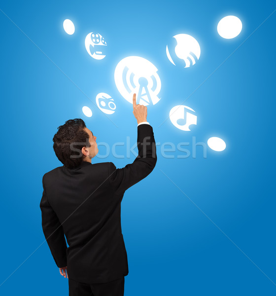 business man pressing touchscreen button  Stock photo © ra2studio