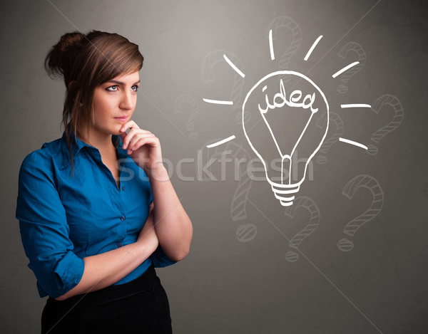 Young girl comming up with a light bubl idea sign Stock photo © ra2studio