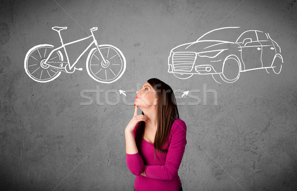 Woman making a choice between bicycle and car Stock photo © ra2studio