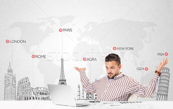 Businessman with world map and major landmarks of the world Stock photo © ra2studio