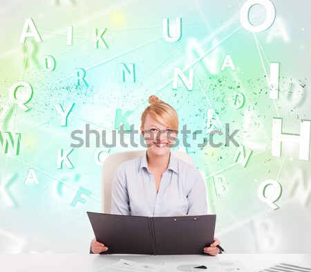 Business woman at desk with green word cloud Stock photo © ra2studio