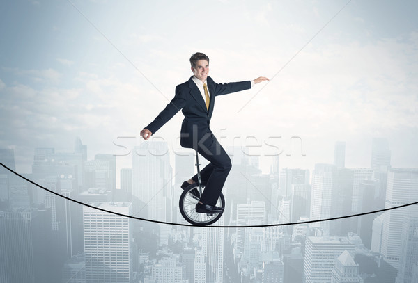 Cesur adam binicilik halat üzerinde Cityscape Stok fotoğraf © ra2studio