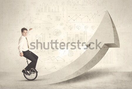 Happy business man riding a monocycle up on an arrow  Stock photo © ra2studio