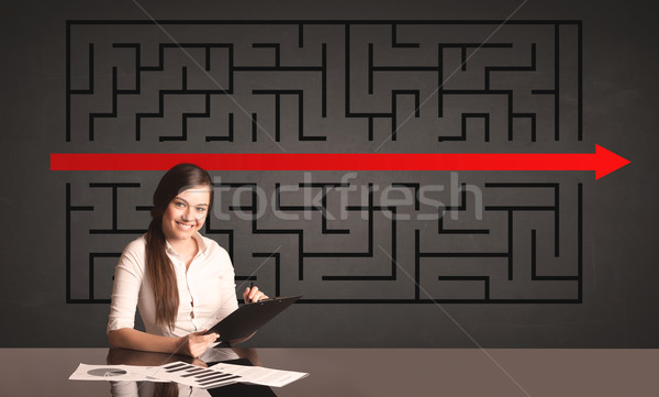 businesswoman with a solved puzzle in background Stock photo © ra2studio