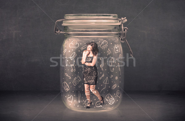 Business woman captured in glass jar with hand drawn media icons Stock photo © ra2studio