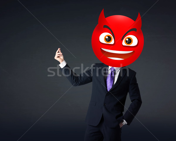 businessman wears devil smiley face Stock photo © ra2studio