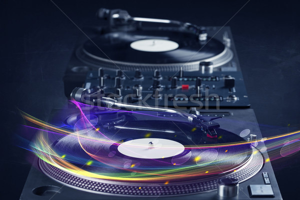 Stock photo: Turntable playing vinyl with glowing abstract lines