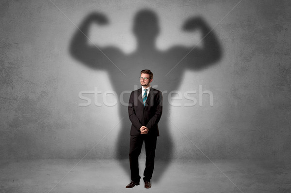 Empresario muscular sombra detrás atrás grave Foto stock © ra2studio