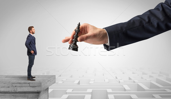 Little businessman from the top of the labyrinth thinking about strategies Stock photo © ra2studio