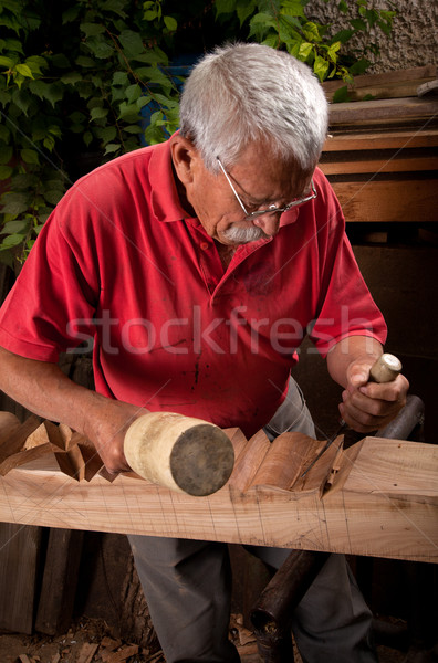 Old woodcarver working with mallet Stock photo © ra2studio