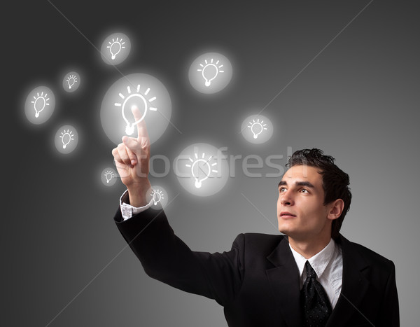  man pressing a touchscreen button Stock photo © ra2studio