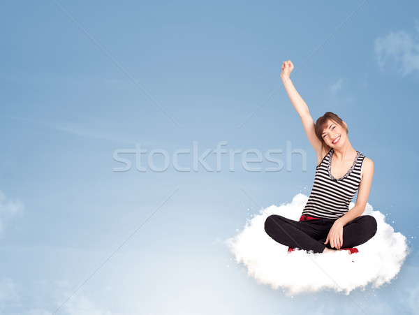 Stock photo: Young woman sitting on cloud with copy space