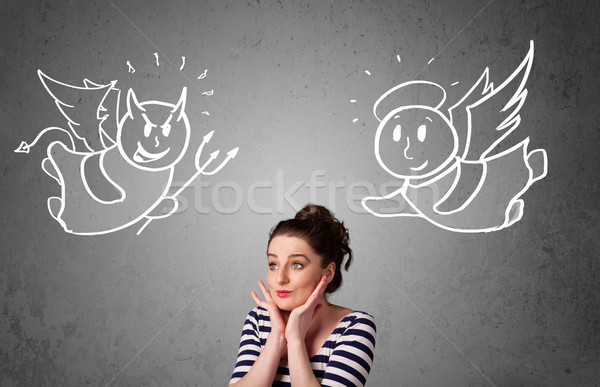 Woman standing between the angel and the devil Stock photo © ra2studio