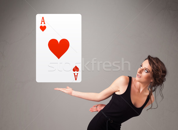 Beautifu woman holding a red heart ace Stock photo © ra2studio