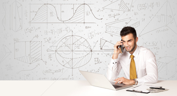 Businessman with business calculations background Stock photo © ra2studio