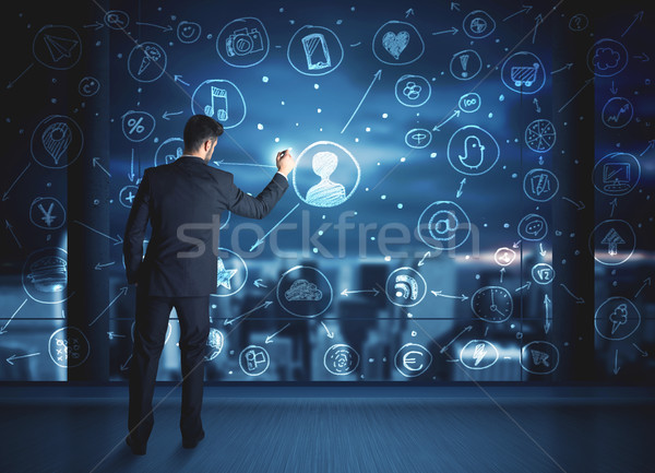 Stock photo: Businessman drawing social media connection scheme