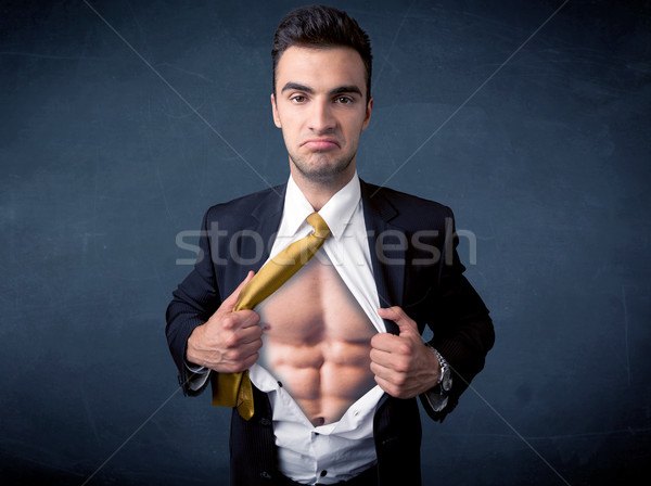 Businessman tearing off shirt and showing mucular body Stock photo © ra2studio