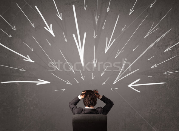 Stock photo: Business man with hand drawn arrows pointing at his head