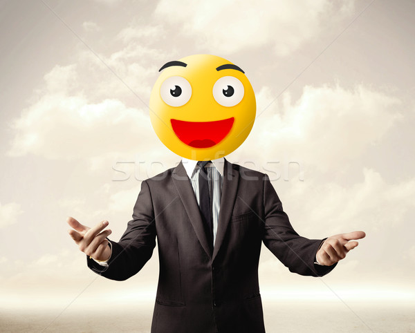 businessman wears yellow smiley face Stock photo © ra2studio