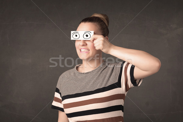 Funny woman looking with hand drawn paper eyes Stock photo © ra2studio
