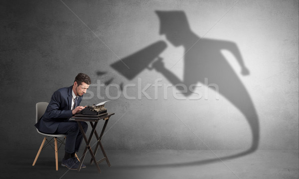 Businessman shadow yelling to himself concept Stock photo © ra2studio