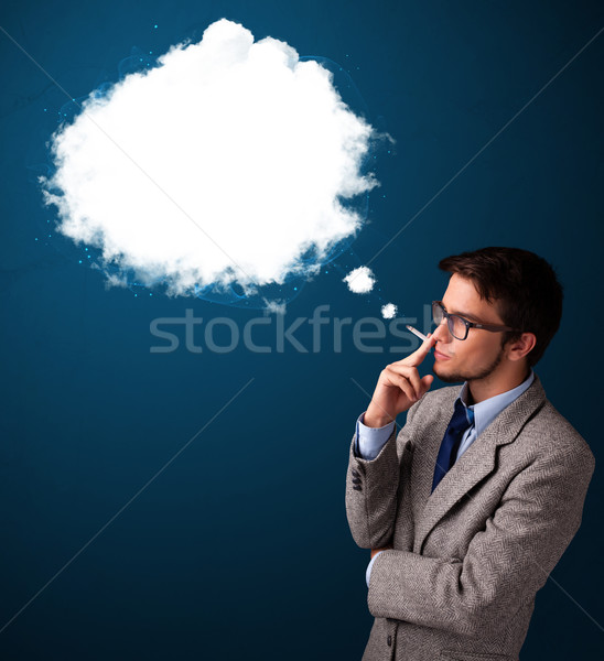 Young man smoking unhealthy cigarette with dense smoke Stock photo © ra2studio