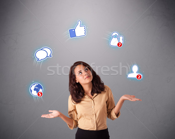 Séduisant jeune femme jonglerie réseau social icônes permanent [[stock_photo]] © ra2studio