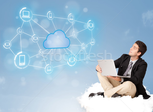 Happy businessman sitting on cloud with cloud computing Stock photo © ra2studio