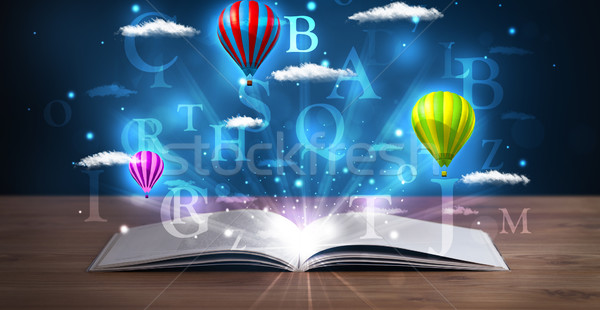 Stock photo: Open book with glowing fantasy abstract clouds and balloons