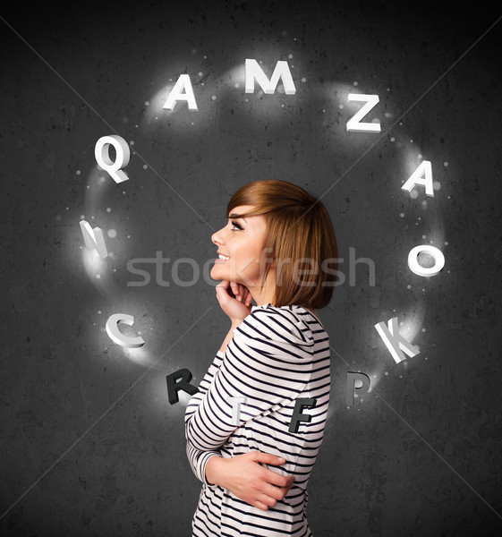Young woman thinking with letter circulation around her head Stock photo © ra2studio
