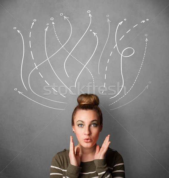 Young woman with arrows coming out of her head Stock photo © ra2studio