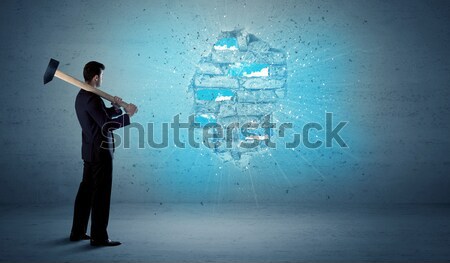 Business man hitting brick wall with huge hammer Stock photo © ra2studio