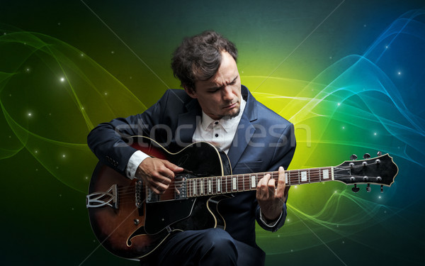 Guitariste coloré sérieux classique wallpaper [[stock_photo]] © ra2studio