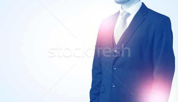 Young businessman standing and thinking Stock photo © ra2studio