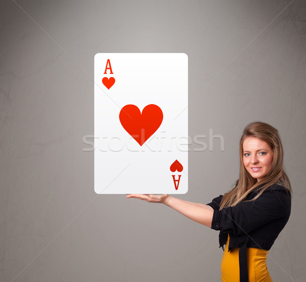 Beautifu woman holding a red heart ace Stock photo © ra2studio