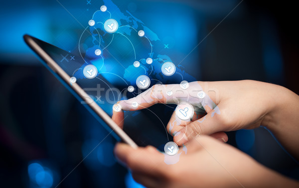 Hand touching tablet pc, social network concept Stock photo © ra2studio