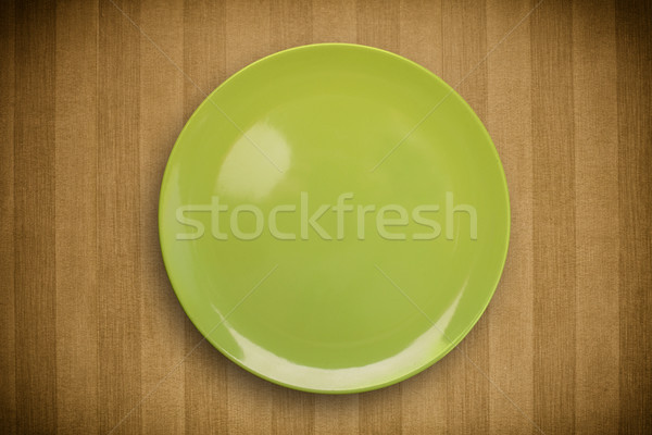 Colorful empty plate on grungy background table  Stock photo © ra2studio