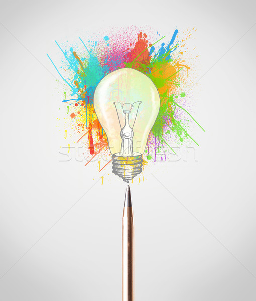 Pen close-up with colored paint splashes and lightbulb Stock photo © ra2studio