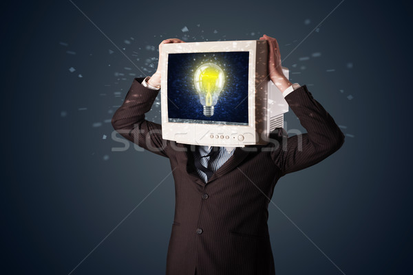 Business man with a pc monitor head and idea light bulb in the d Stock photo © ra2studio