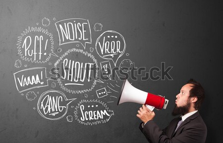 Guy in suit yelling into megaphone and hand drawn speech bubbles Stock photo © ra2studio