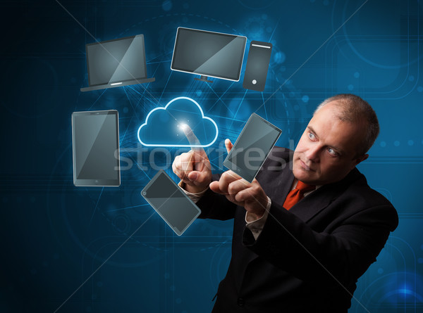Businessman touching high technology cloud service Stock photo © ra2studio