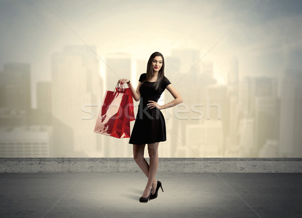 City woman standing with shopping bags Stock photo © ra2studio