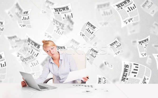 Business woman at desk with stock market newspapers Stock photo © ra2studio