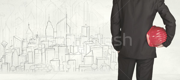 Businessman with drawn city view Stock photo © ra2studio