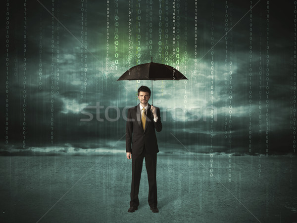 Business man standing with umbrella data protection concept Stock photo © ra2studio