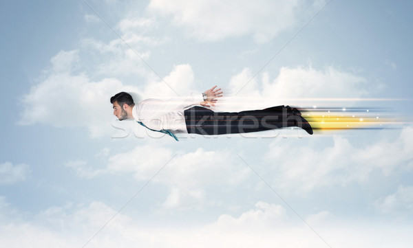 Glücklich Geschäftsmann unter schnell Himmel Wolken Stock foto © ra2studio