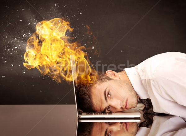 Stressed business man's head is burning Stock photo © ra2studio