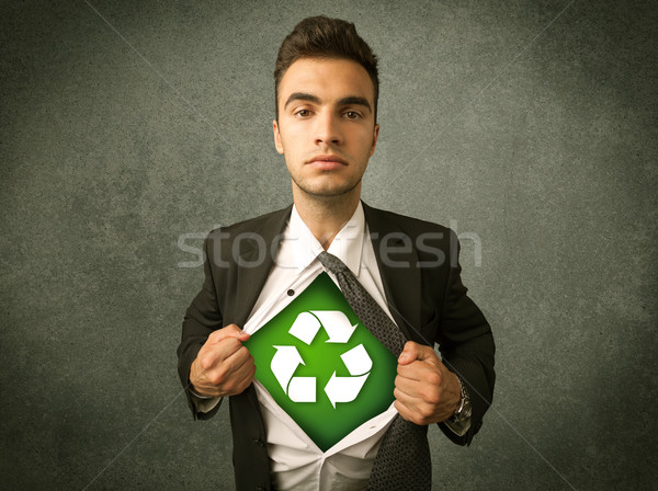 Enviromentalist business man tearing off shirt with recycle sign Stock photo © ra2studio